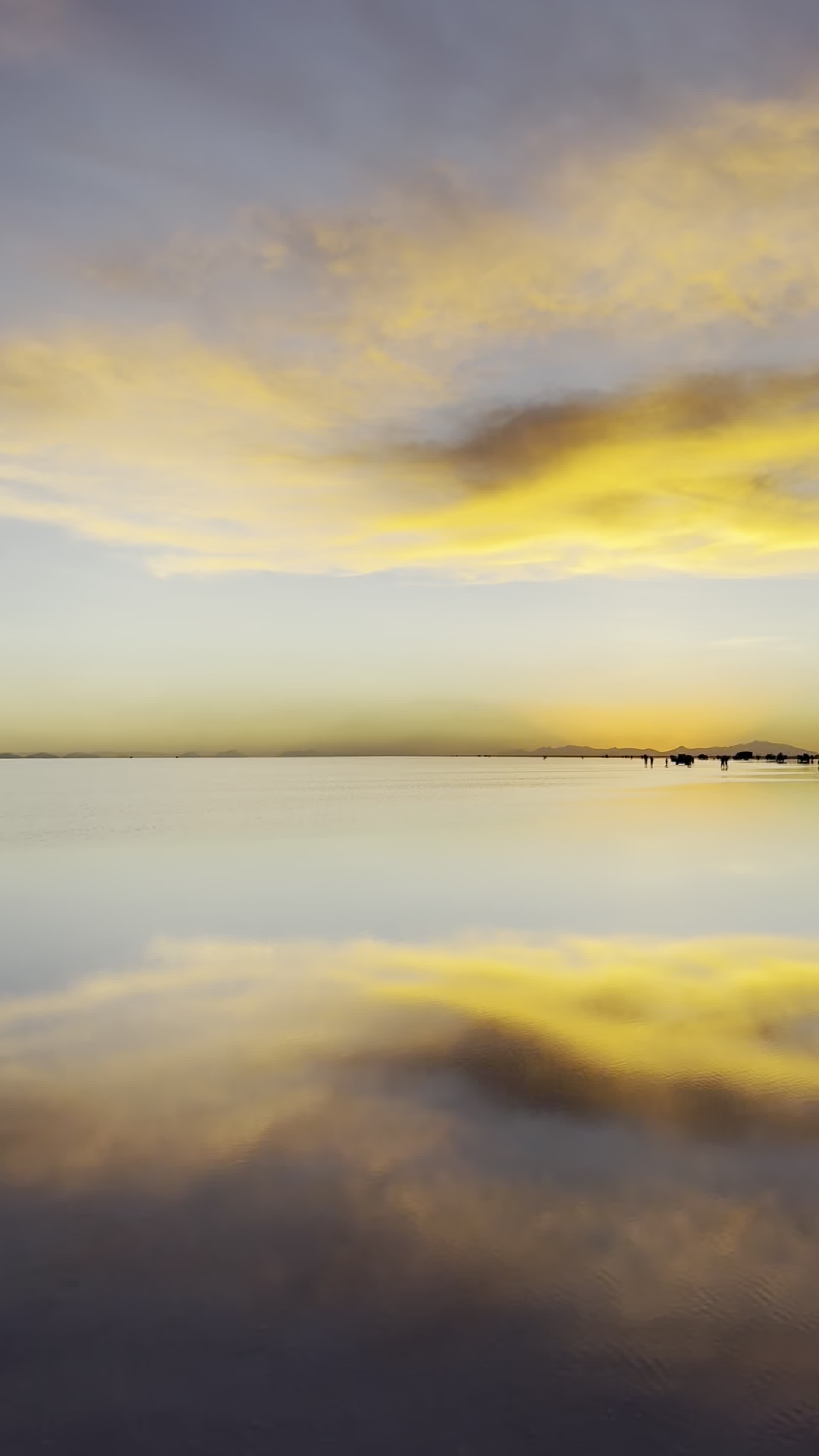 The wet salar at sunset, sky doubled in the mirror