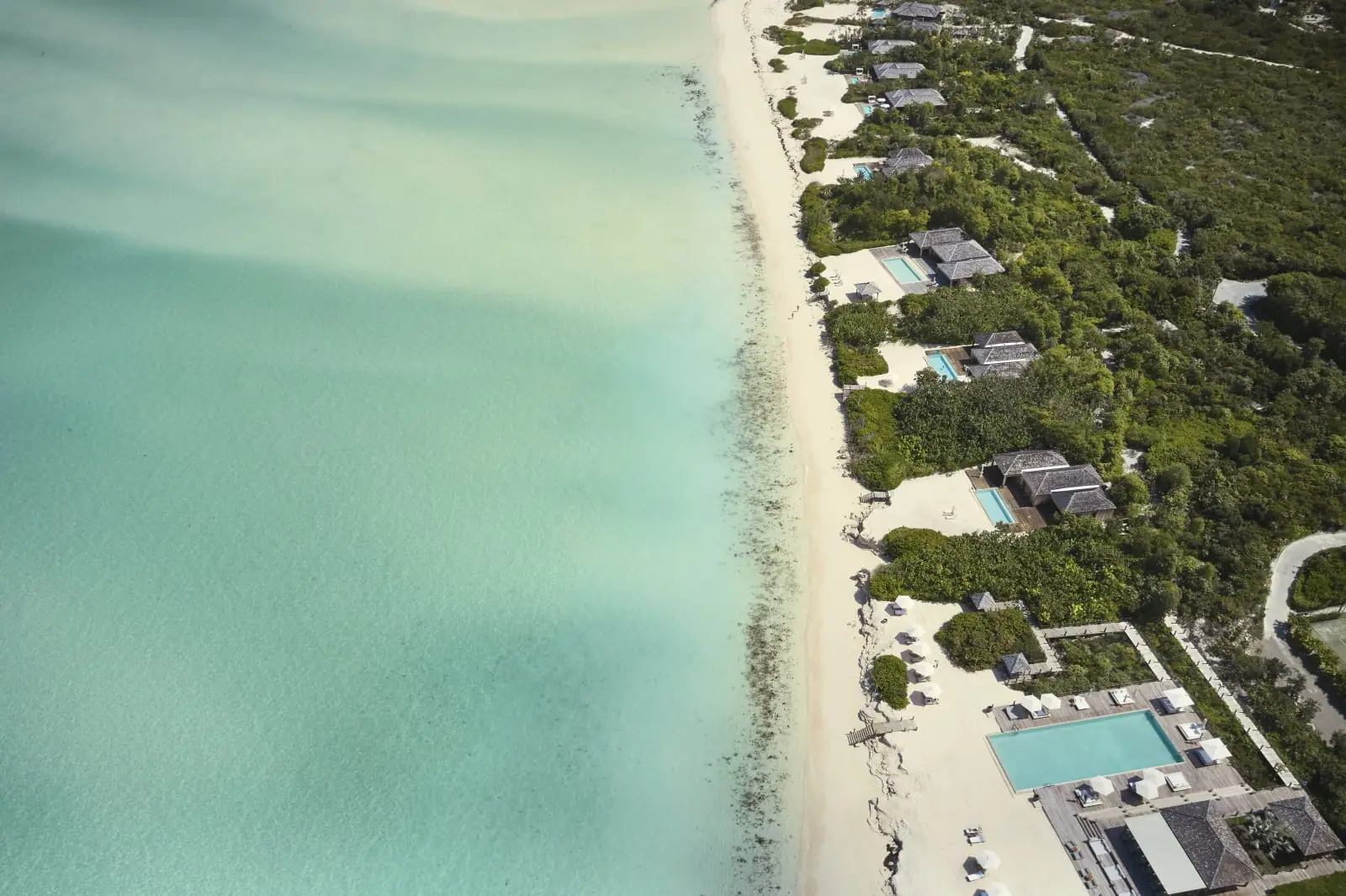 Aerial view of Grace Bay's white sand and turquoise water