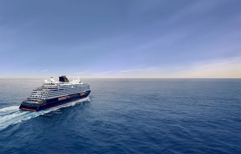Explora I seen from the air at sea, her terraced white decks and pools set against deep blue water