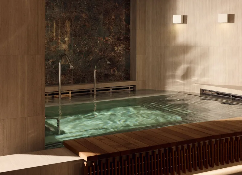 The thermal pool in the Ocean Wellness spa, tiled in pale stone under a glass ceiling