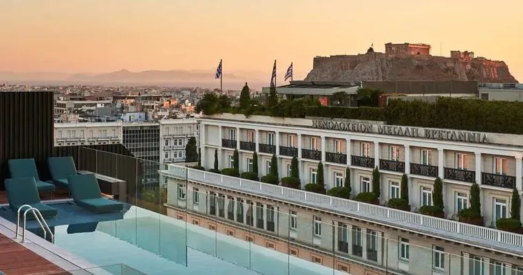 The rooftop pool at Athens Capital Center Hotel looking across to the Acropolis