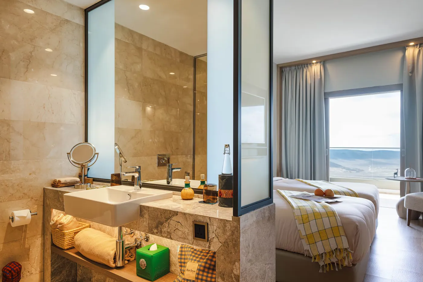 The Rim Room bathroom vanity, open to the bedroom and the crater view