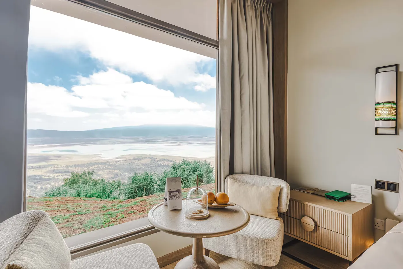 Two chairs at the Rim Room window looking down into the Ngorongoro Crater