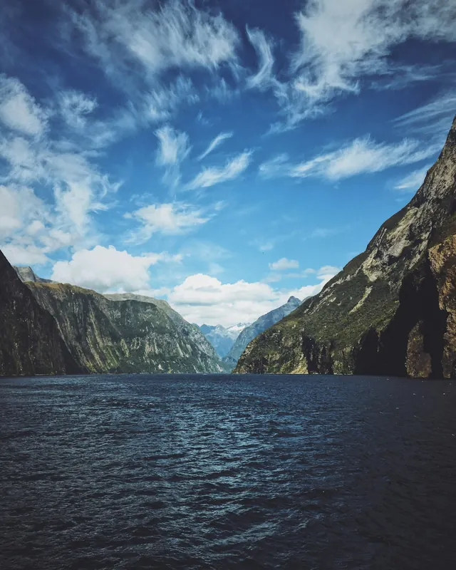 Milford Sound between steep mountain walls in New Zealand