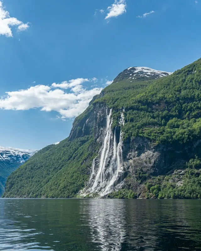 A waterfall pouring into the Geirangerfjord